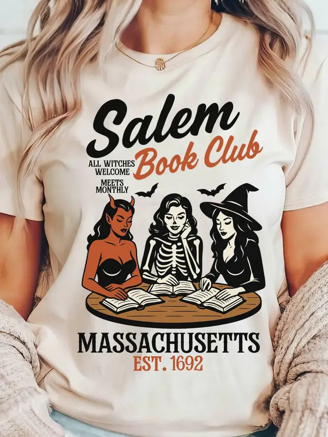 White t-shirt with 'Salem Book Club' design featuring three women in witch costumes around books.