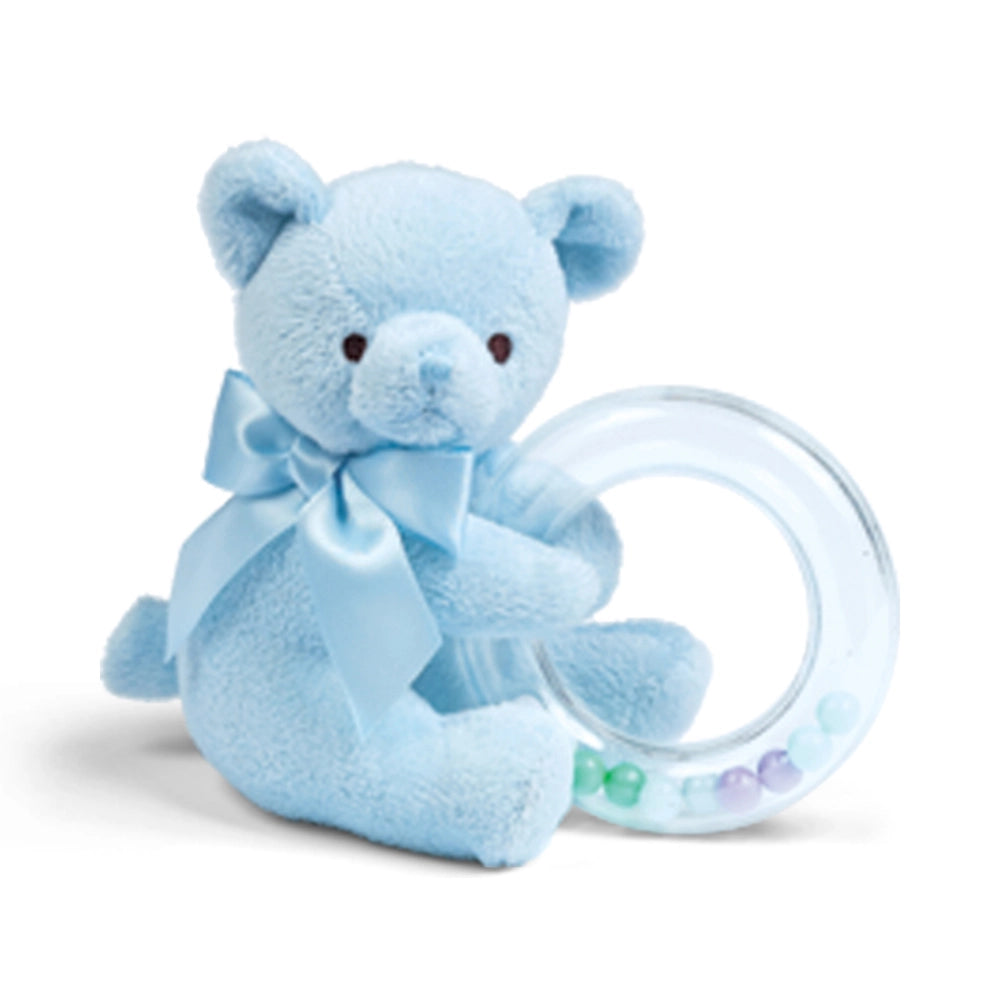 Blue teddy bear with a teething ring on a white background