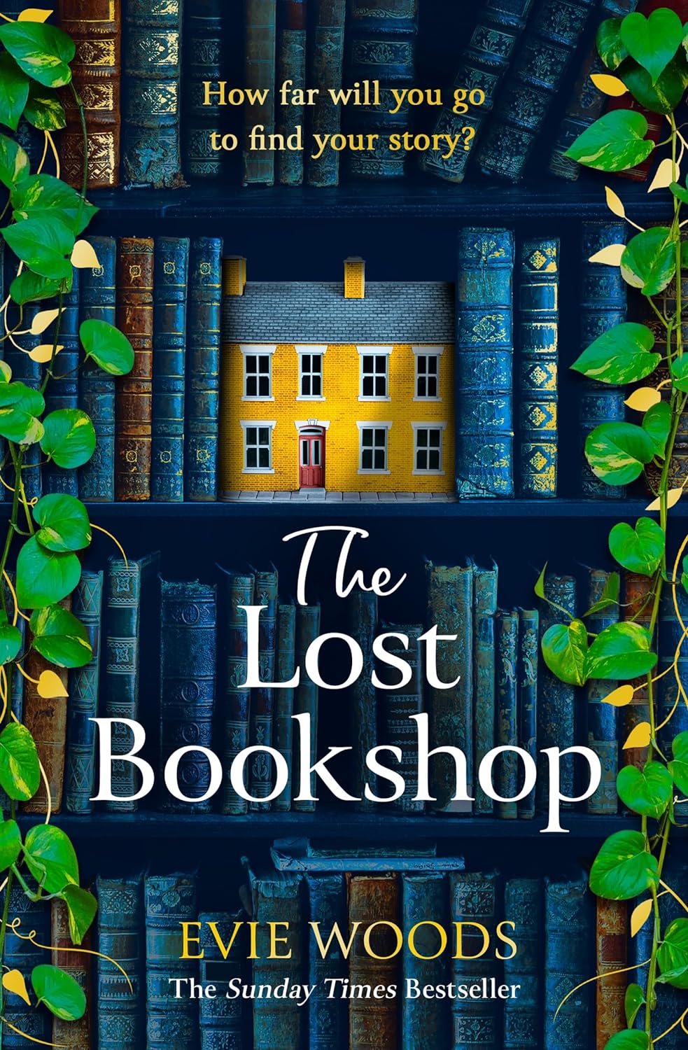 Book cover of 'The Lost Bookshop' with a house hidden among books and greenery.