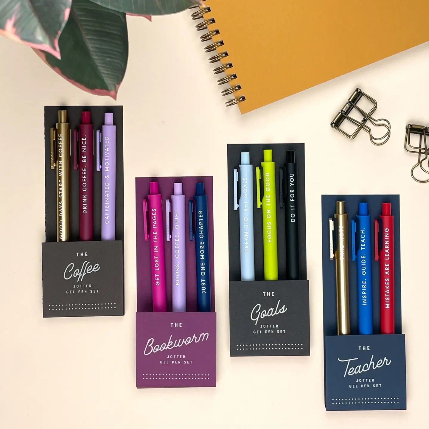 Set of pens in various packaging on a light background