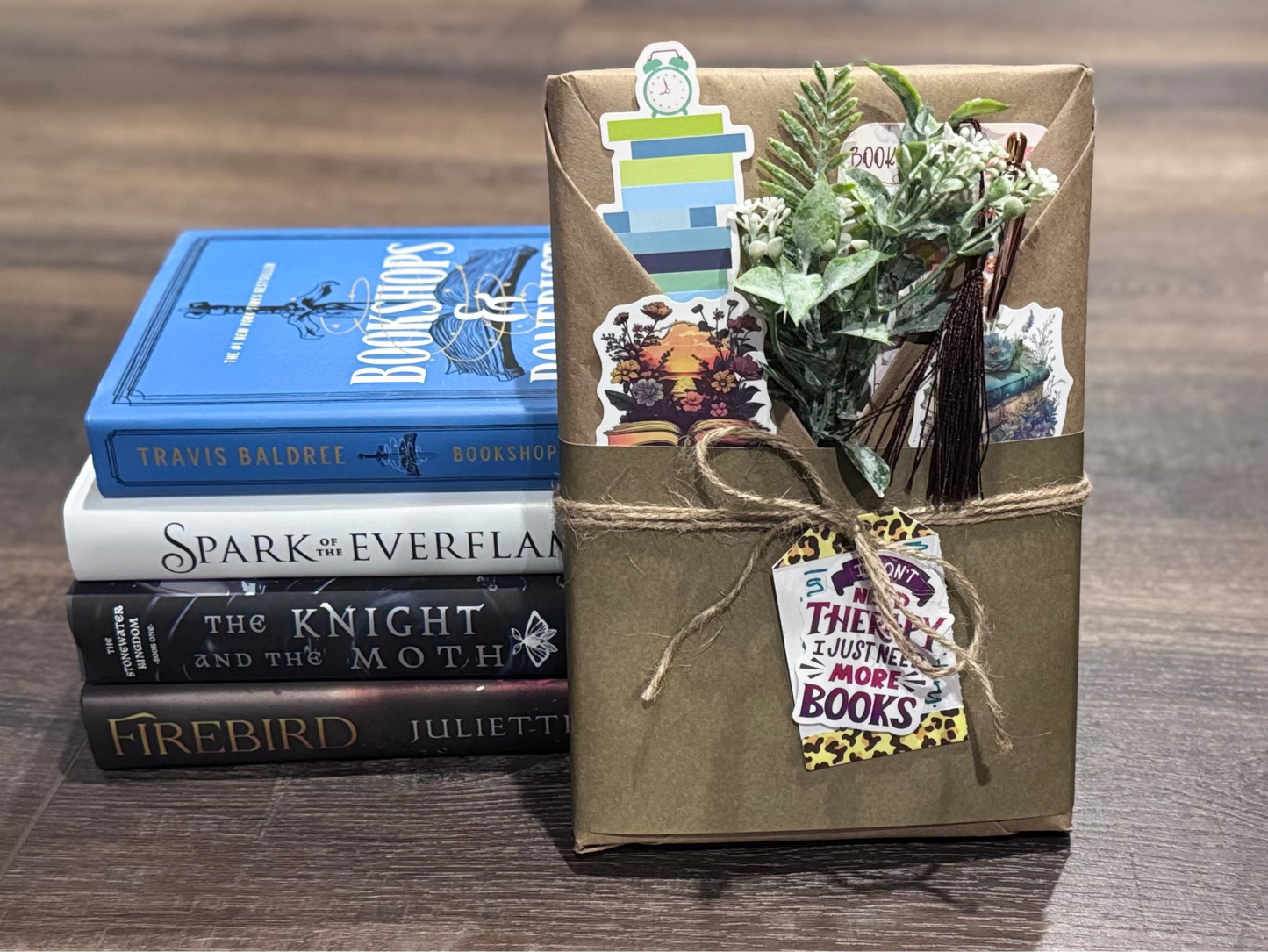 Stack of books with a decorative box on a wooden surface