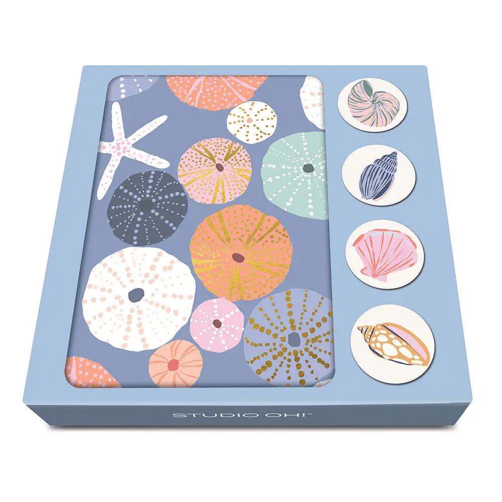 Box of decorative stickers with sea-themed designs on a white background