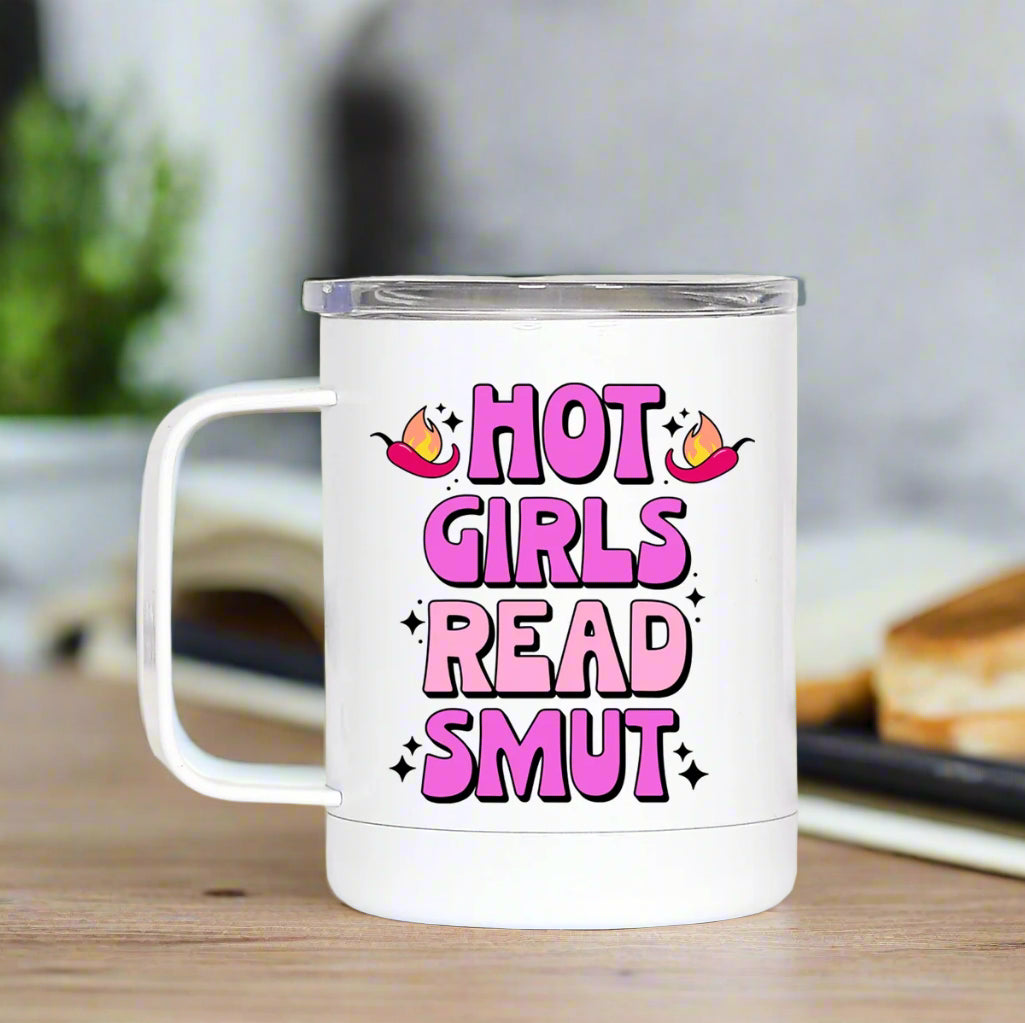 White mug with pink text 'HOT GIRLS READ SMUT' on a white background