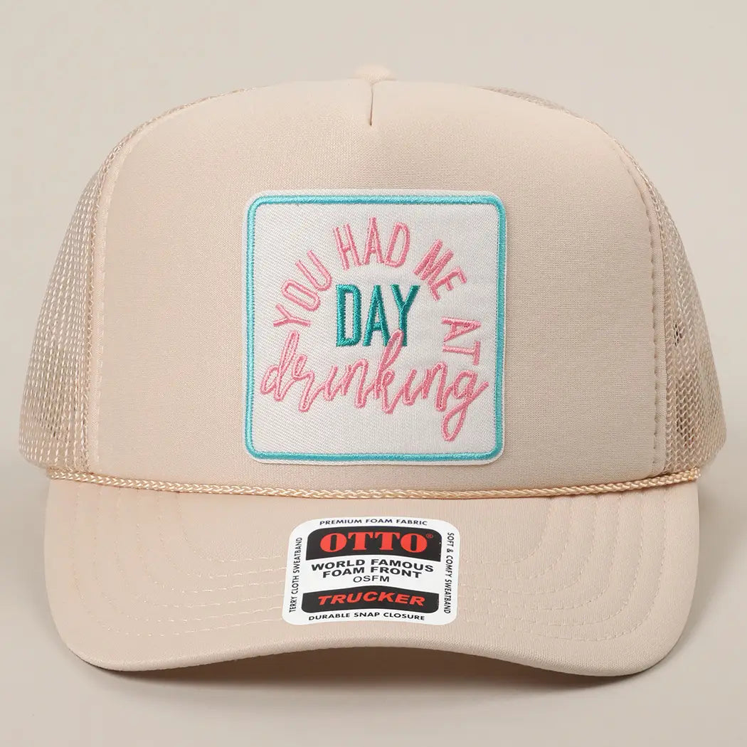 tan trucker hat with a patch that says "You had me at day drinking"