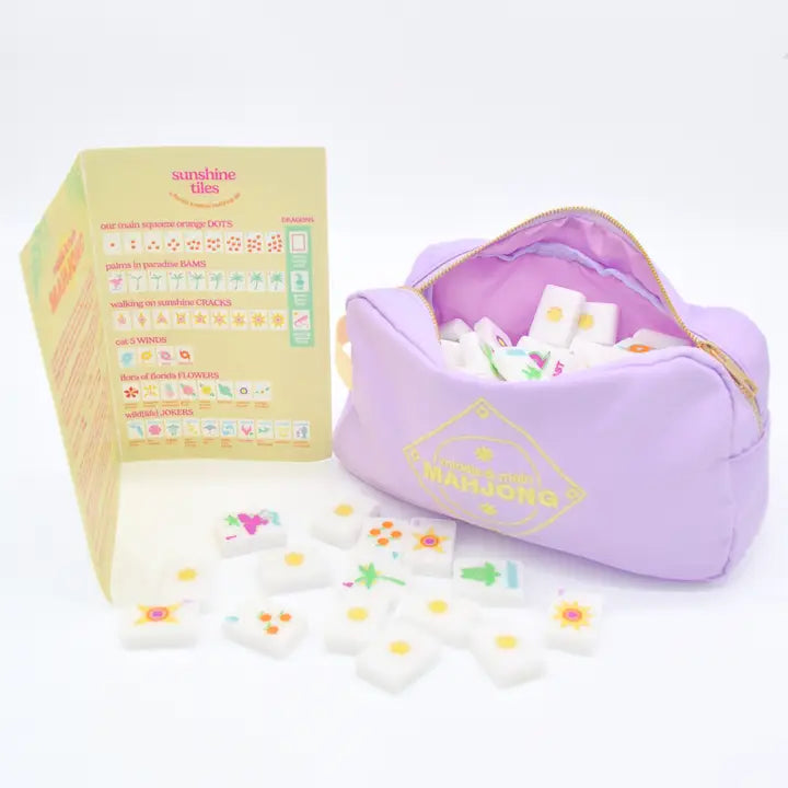 Set of colorful tiles with a purple pouch on a white background