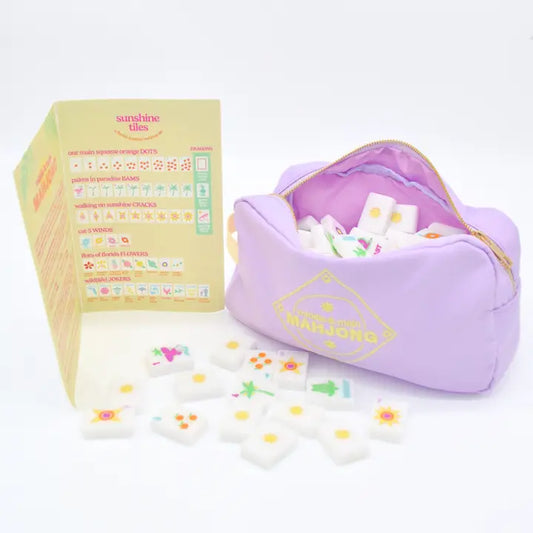 Set of colorful tiles with a purple pouch on a white background