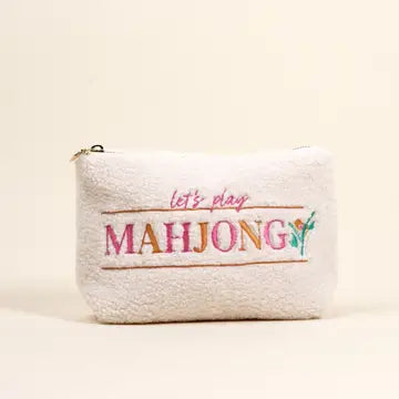 White pouch with 'let's play MAHJONG' text on a beige background