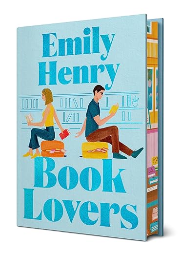 Book cover for 'Book Lovers' by Emily Henry, featuring a light blue background with colorful illustrations of a couple sitting on book spines, shown as a 3D book mockup.