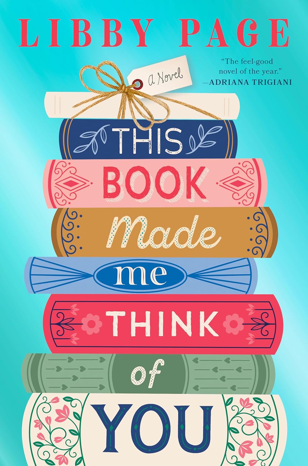 Cover of This Book Made Me Think of You by Libby Page featuring a colorful stack of illustrated books and lettering. A heartwarming contemporary fiction novel about friendship, love, and meaningful connections.