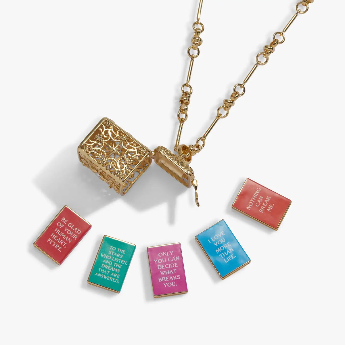 Gold ACOTAR book locket necklace featuring an ornate hinged pendant and five removable miniature books from Sarah J. Maas's A Court of Thorns and Roses series.