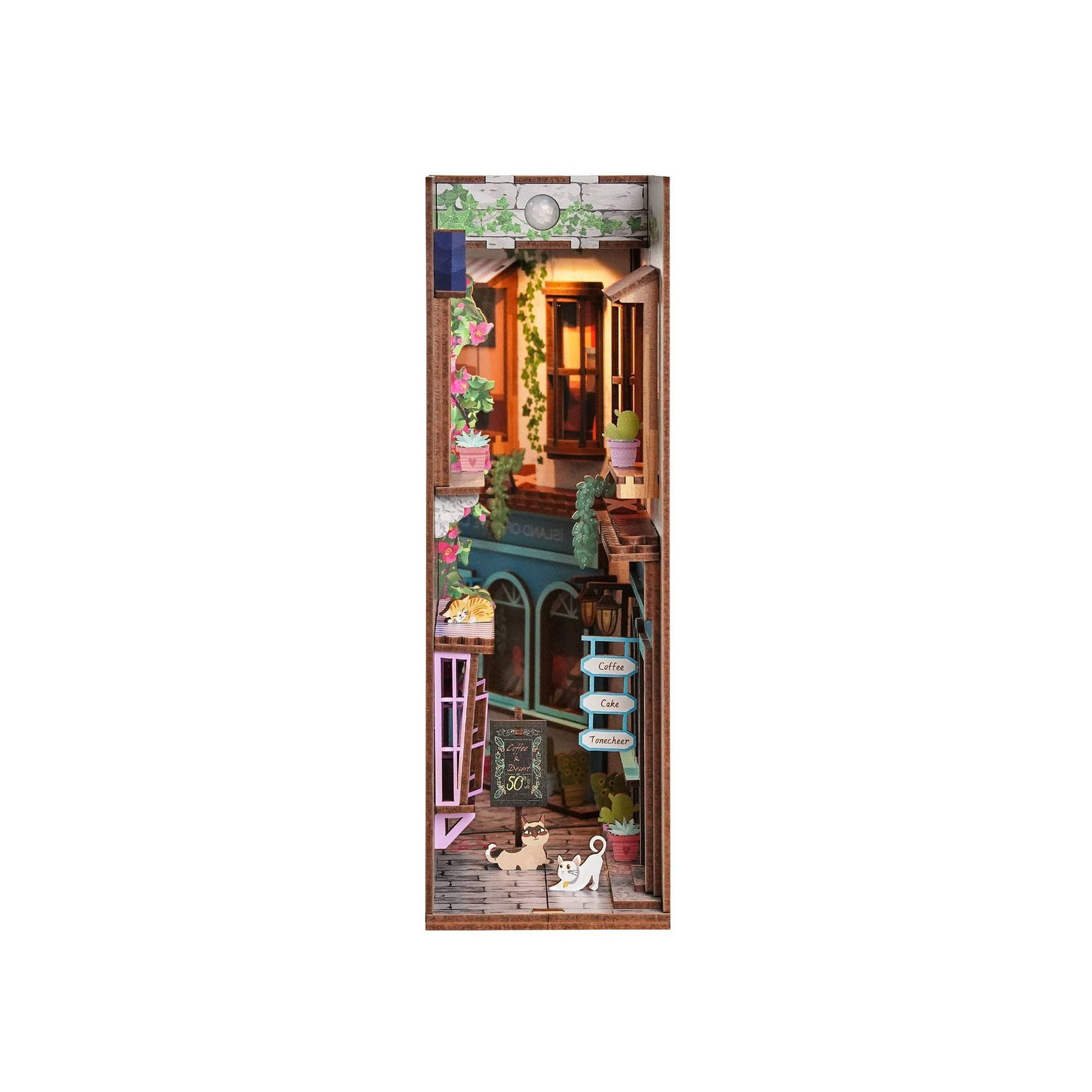Miniature dollhouse with detailed interior on a white background