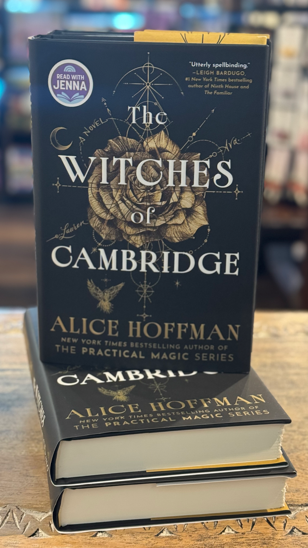 book The Withes of Cambridge by Alice Hoffman stacked on a stack of books