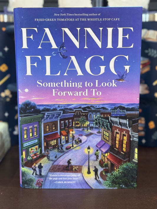 Book cover of 'Something to Look Forward To' by Fannie Flagg with a colorful town illustration on a blue background.