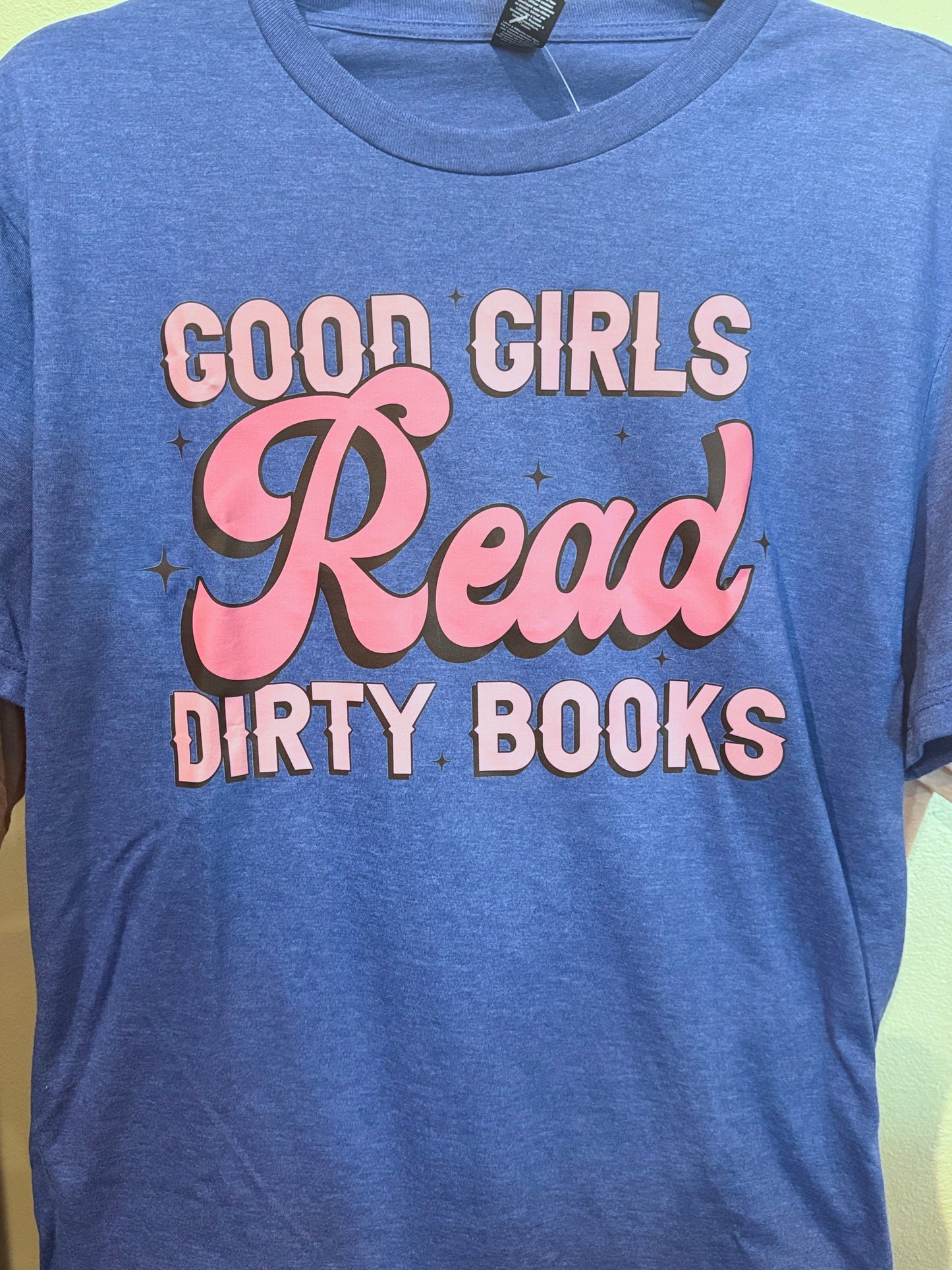 Blue t-shirt with 'Good Girls Read Dirty Books' text in pink and white.