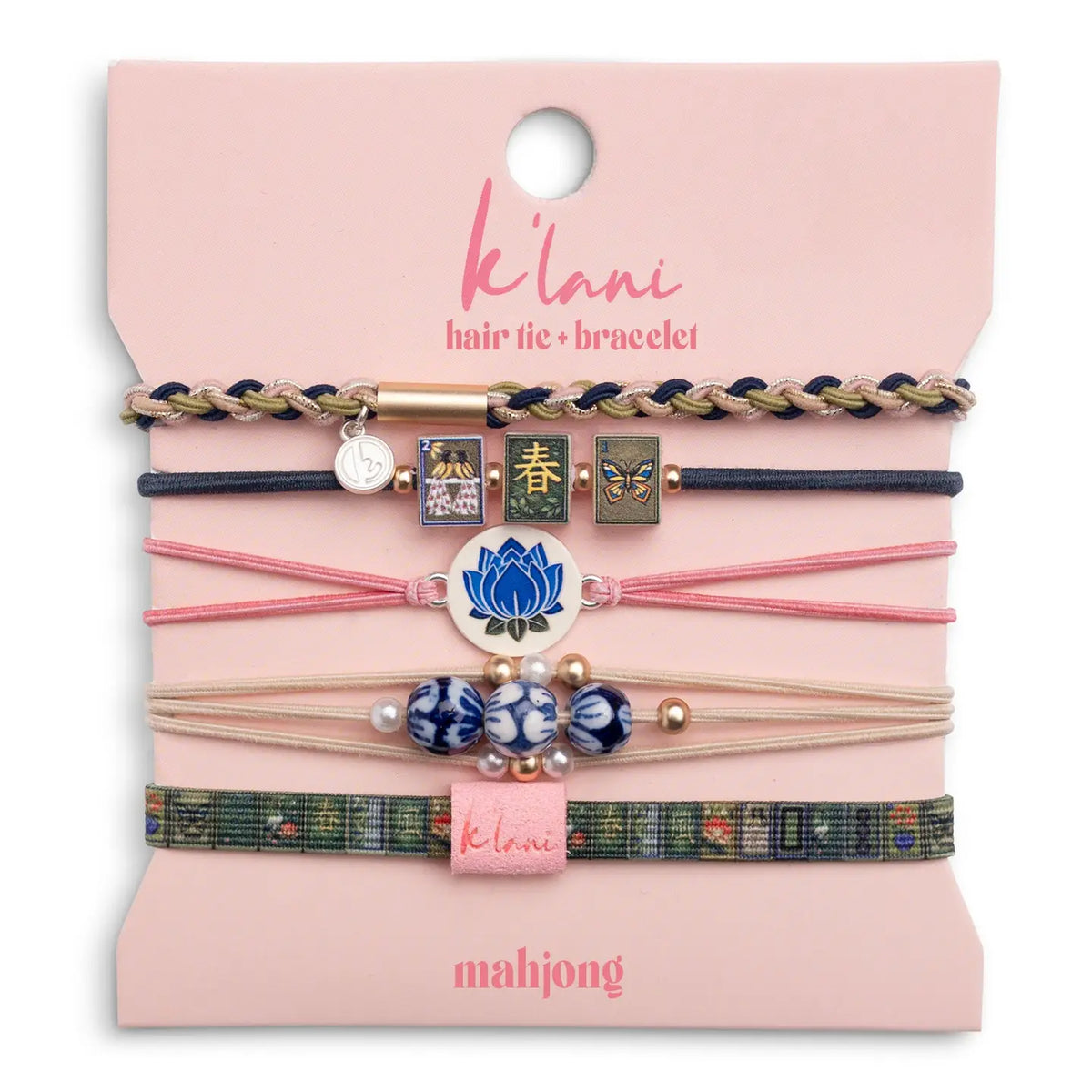 "K'lani Mahjong Hair Tie Bracelet Set featuring five colorful hair ties with mahjong tiles, blue lotus charm, beads, and woven bracelet designs."