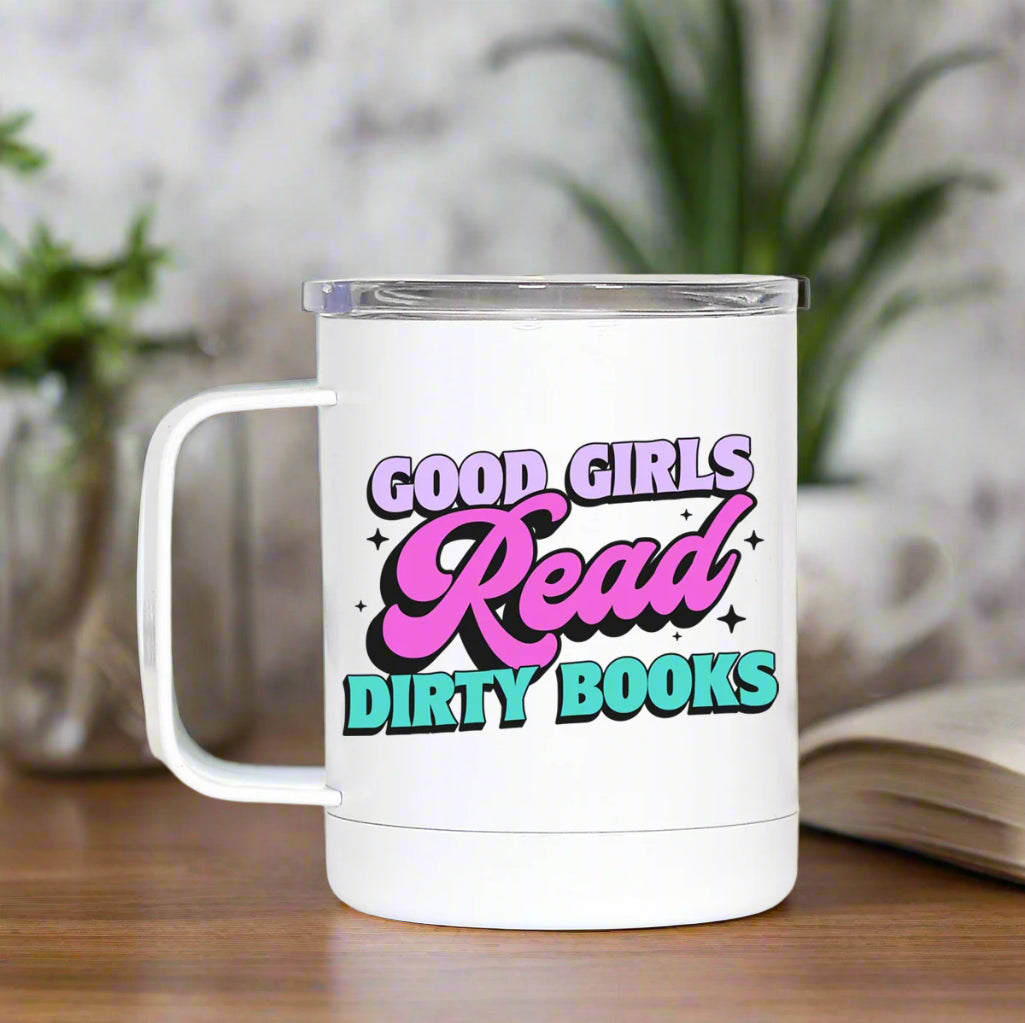 White mug with colorful text 'Good Girls Read Dirty Books' on a white background